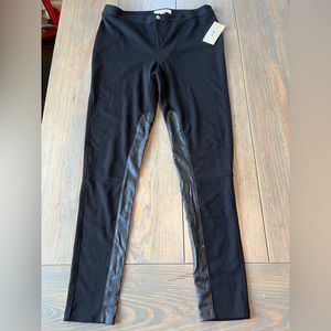 Black Michael Kors leggings.